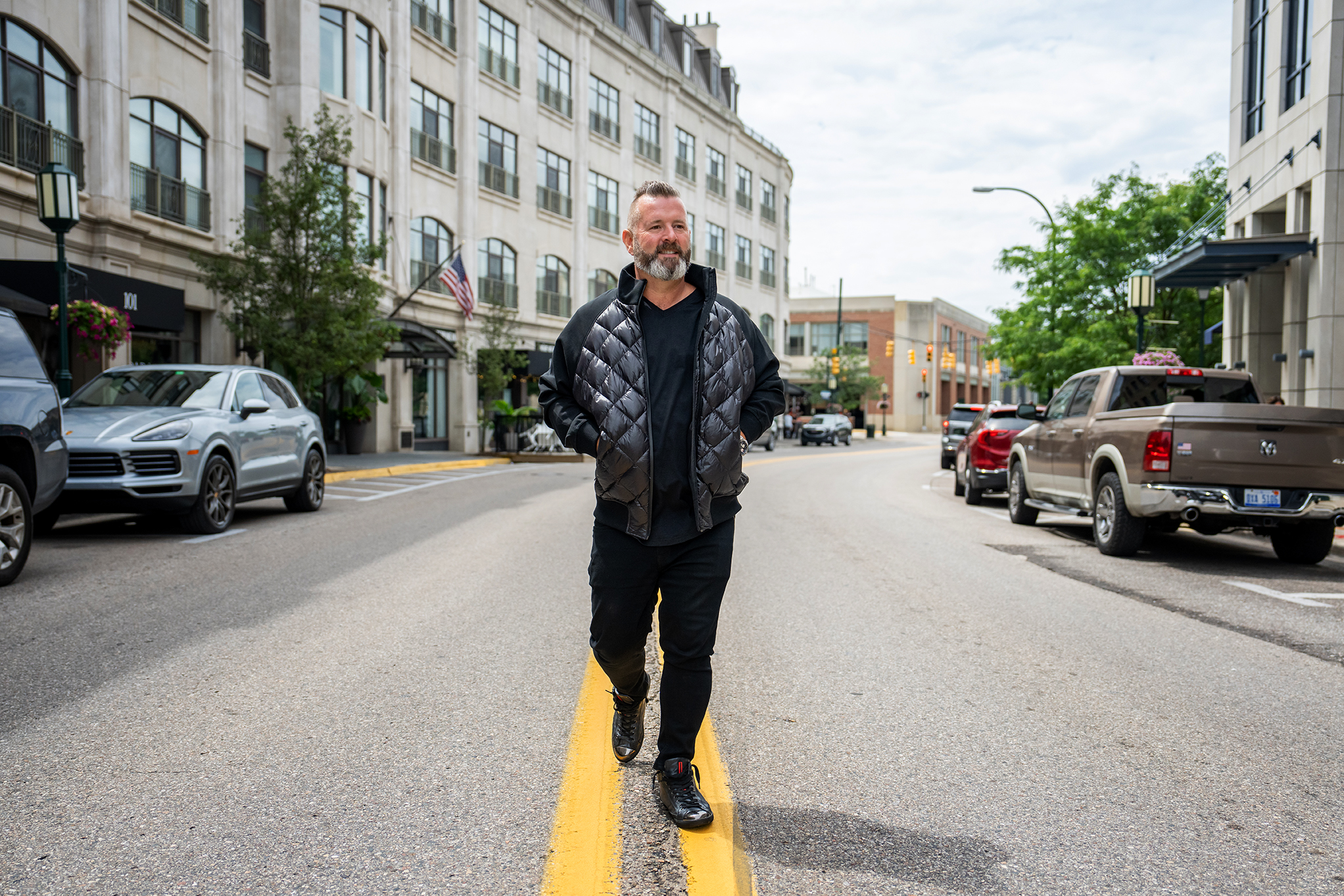 Rick walking along a downtown street